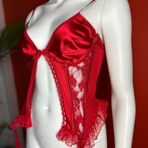 Red satin corset top with lace trim and bow lingerie